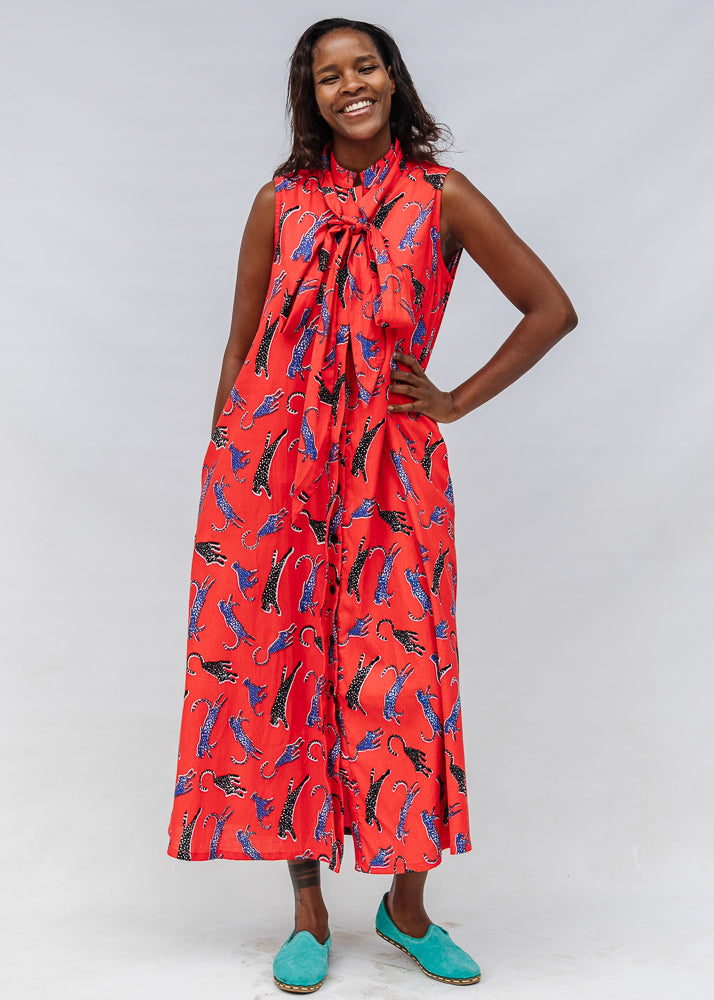 Model wearing red, cat print dress.