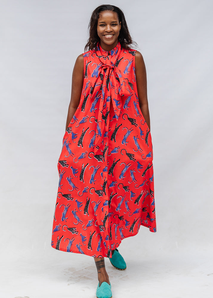 Model wearing red, cat print dress.