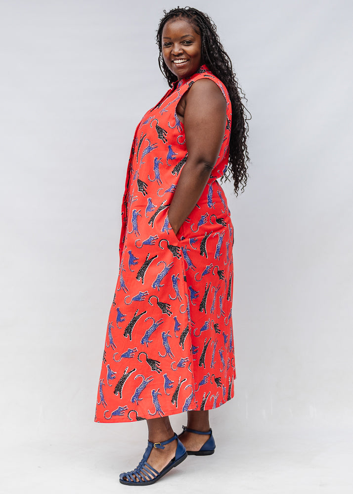 Model wearing red, cat print dress.