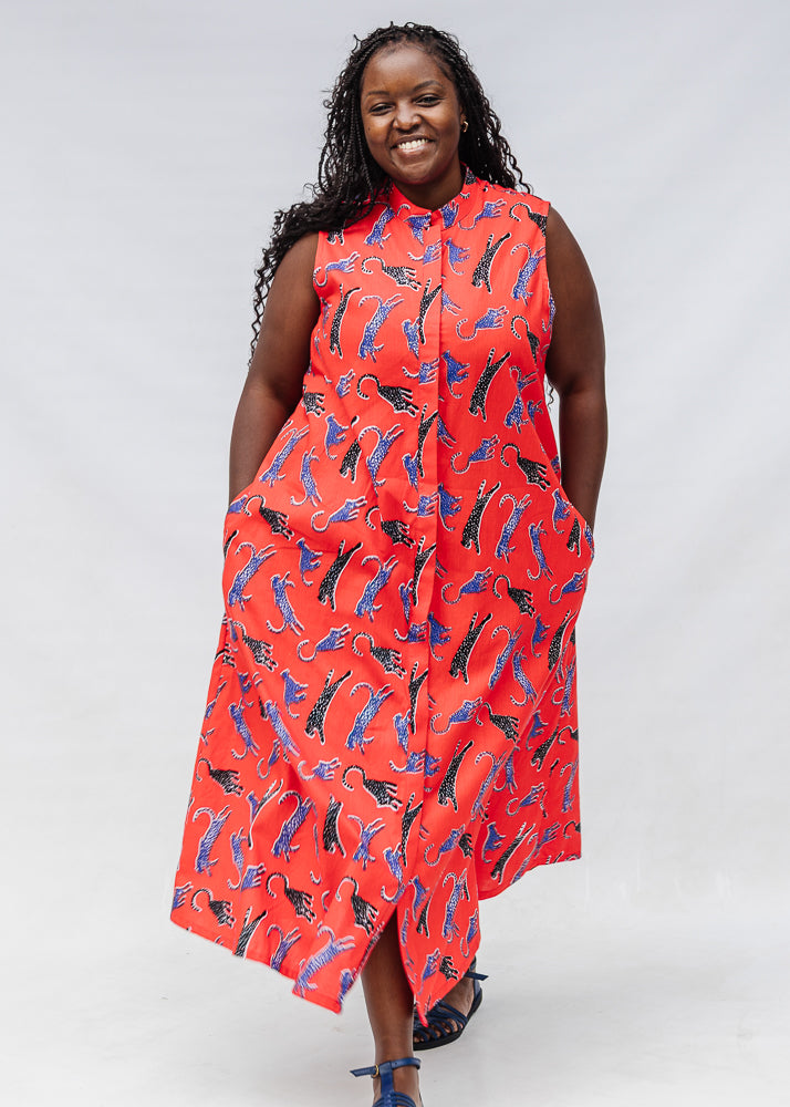 Model wearing red, cat print dress.