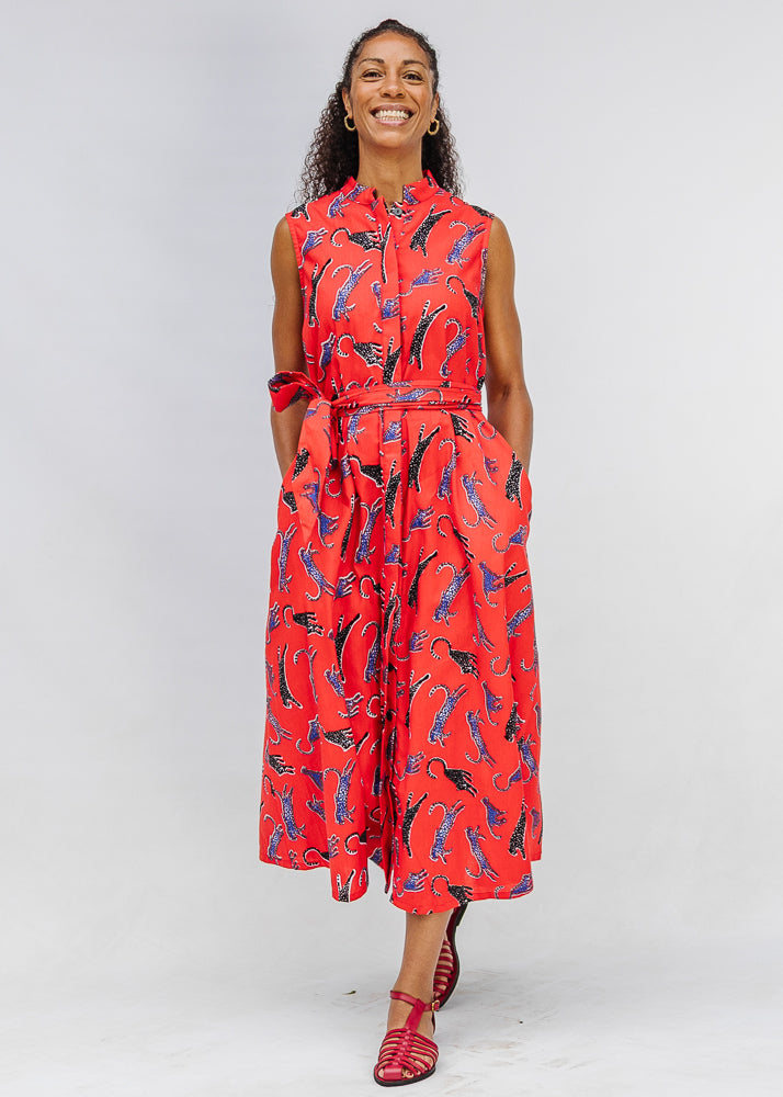 Model wearing red, cat print dress.