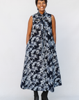 Model wearing navy and gray abstract print maxi dress.
