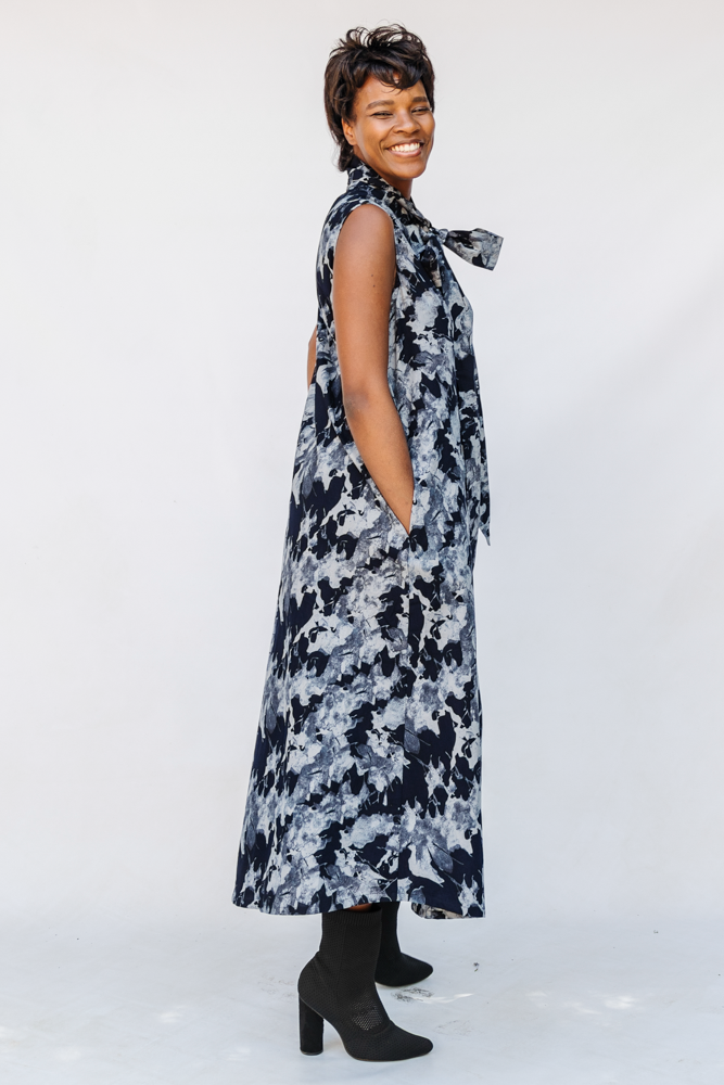 Model wearing navy and gray abstract print maxi dress.