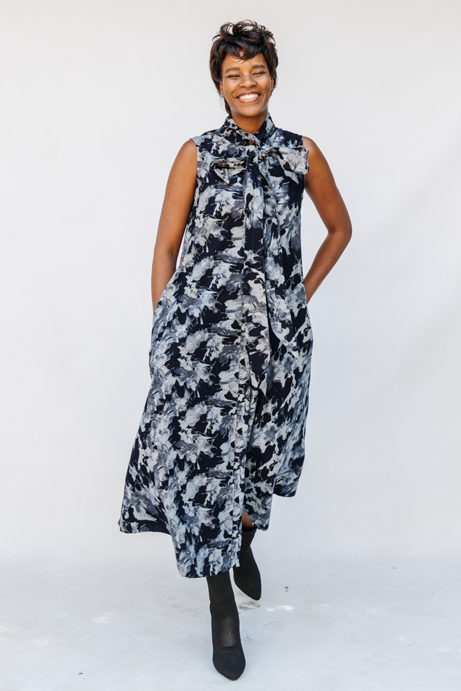 Model wearing navy and gray abstract print maxi dress.