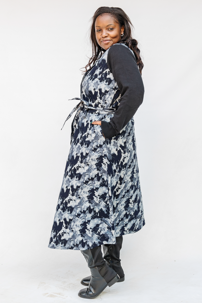 Model wearing navy and gray abstract print maxi dress.
