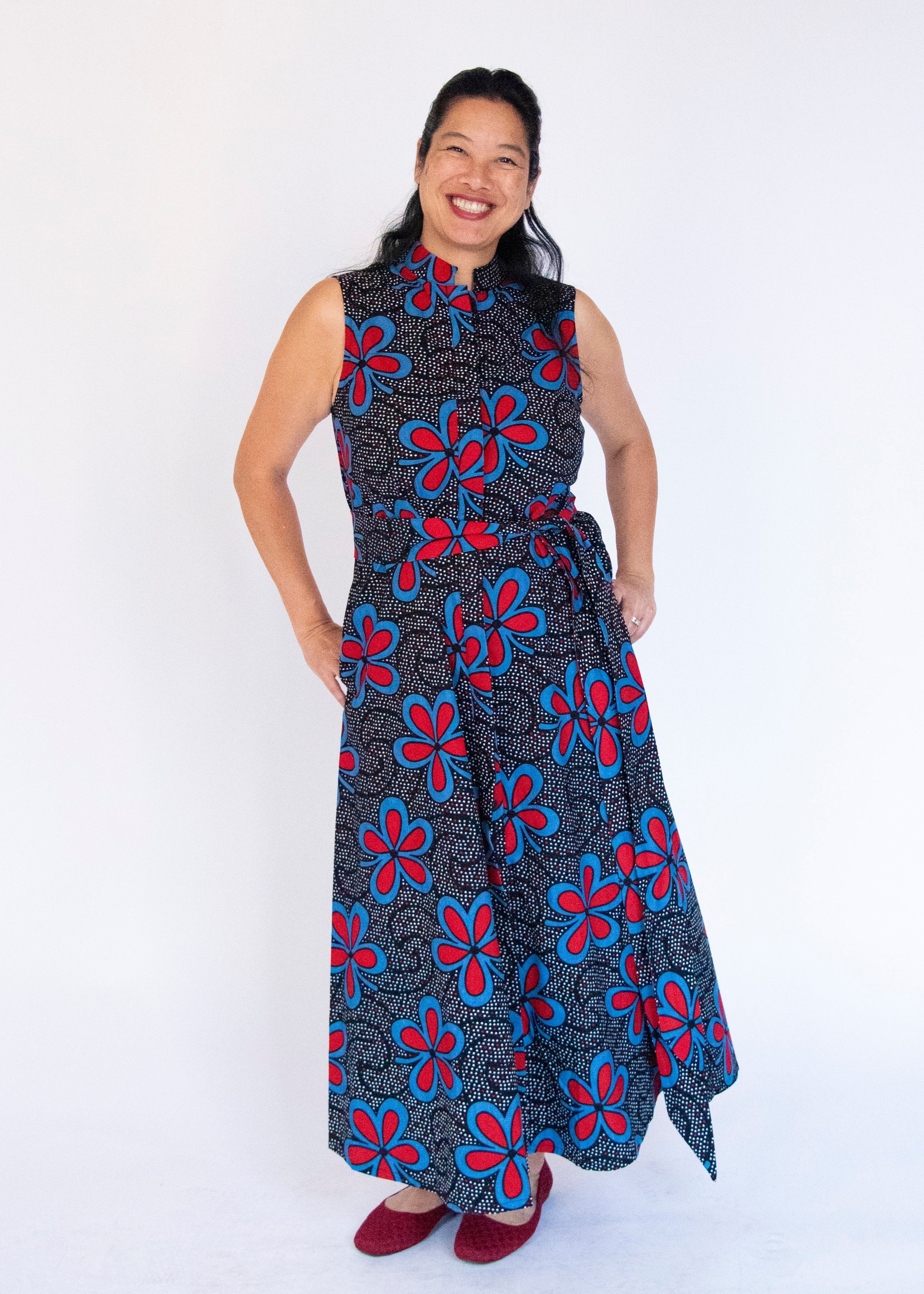 Model wearing floral print maxi dress.