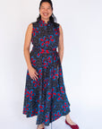 Model wearing floral print maxi dress.