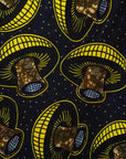 Close up display of navy dress with yellow and brown mushroom print, fabric.