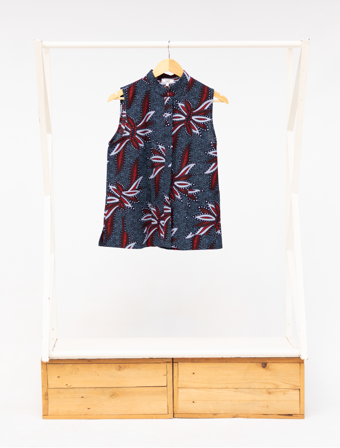 Display of navy and red sleeveless shirt.