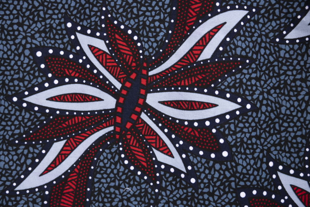 Close up display of navy and red sleeveless shirt, fabric.