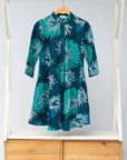Display of turquoise, black, pacific blue, slate and white feathered spiral print dress