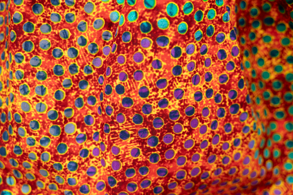 Close up display of multicolored dot print skirt, fabric.