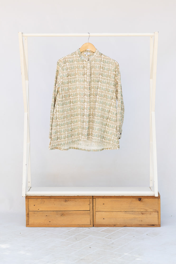 Display of long sleeved shirt with small owl print.