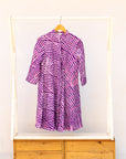 Display of purple and pink plaid batik dress.