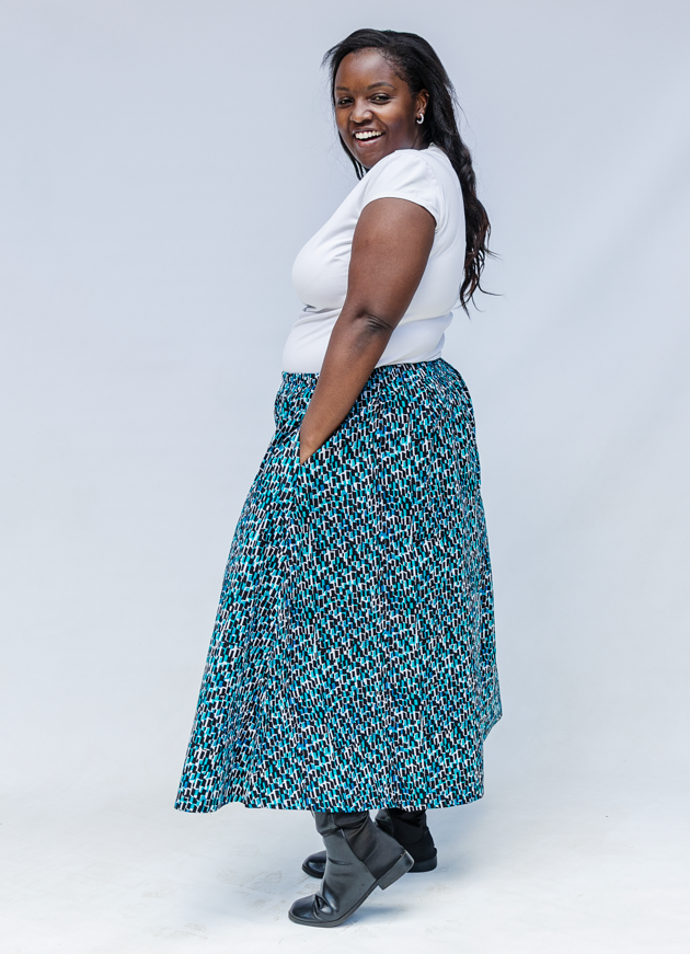 Model wearing aqua, black and white culottes.