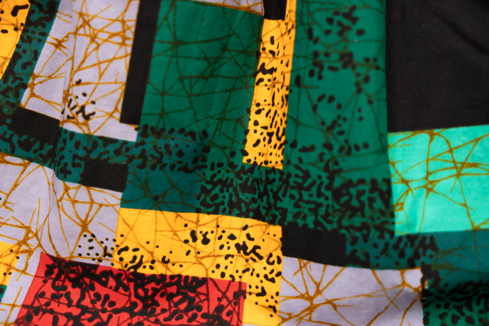 Close up display of multicolored geometric print skirt, fabric.