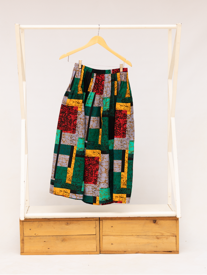 Display of multicolored geometric print skirt.