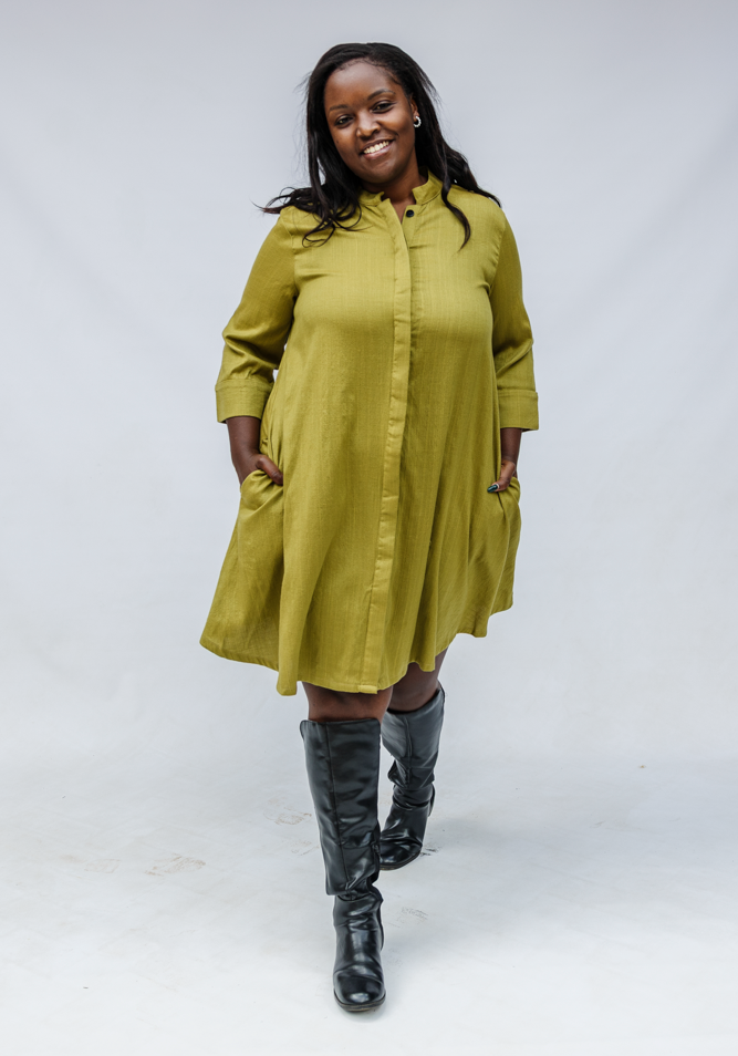 Model wearing olive green linen dress.