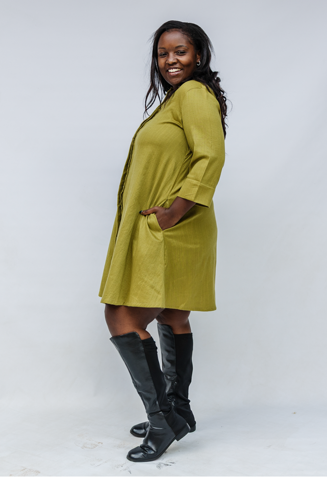 Model wearing olive green linen dress.