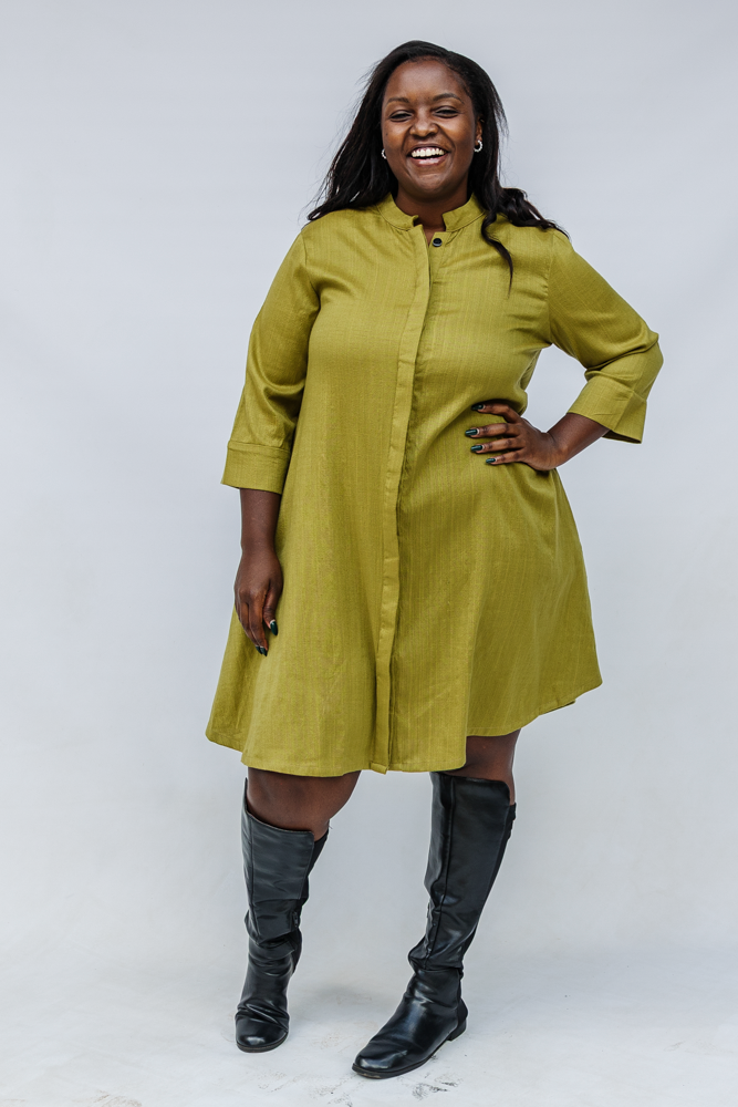 Model wearing olive green linen dress.