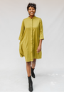 Model wearing olive green linen dress.