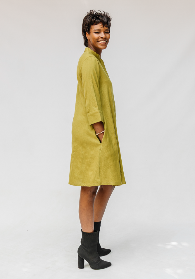 Model wearing olive green linen dress.
