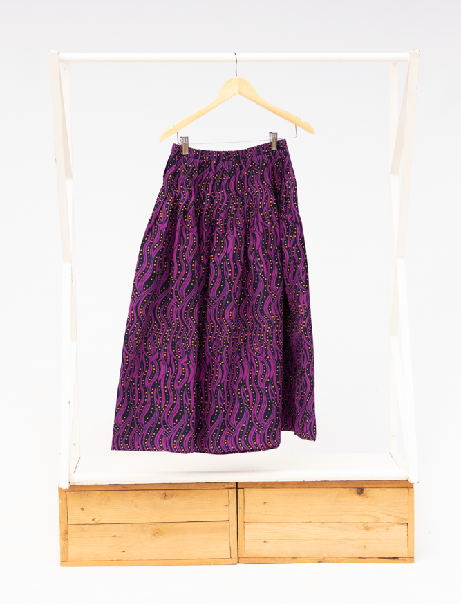 Display of fuchsia skirt with small dot design.