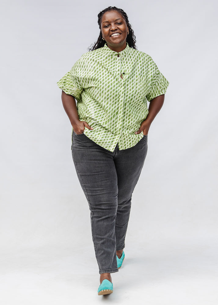 Model wearing green and white plaid shirt.