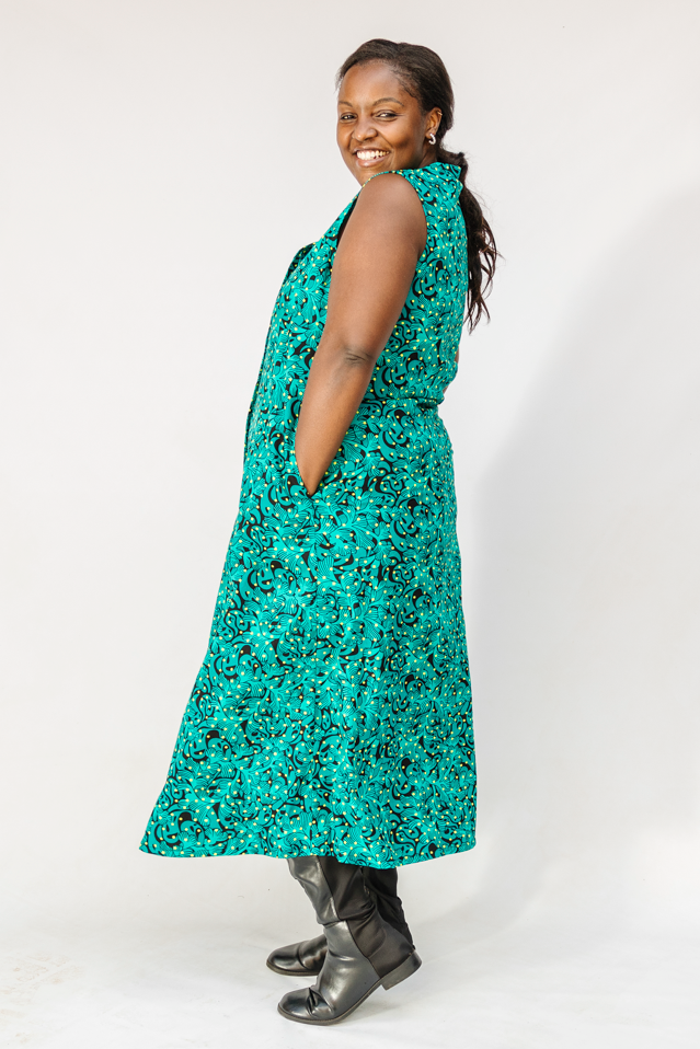Model wearing teal floral maxi dress.
