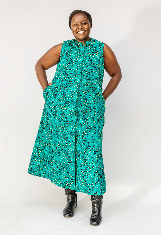 Model wearing teal floral maxi dress.