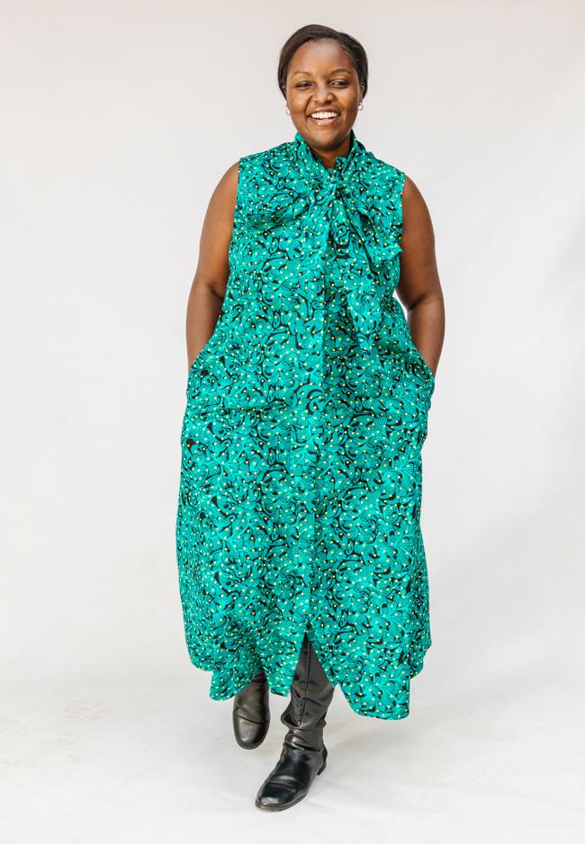 Model wearing teal floral maxi dress.