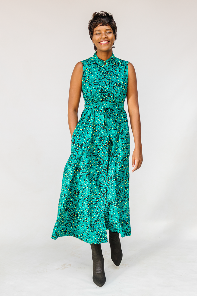  Model wearing teal floral maxi dress.