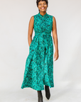  Model wearing teal floral maxi dress.