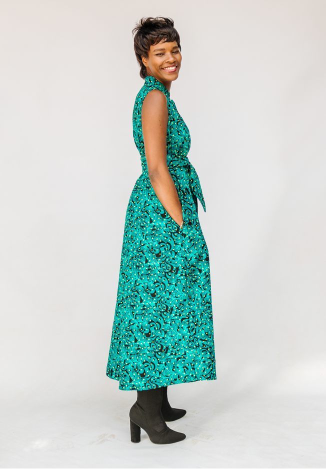 Model wearing teal floral maxi dress.