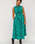 Model wearing teal floral maxi dress.