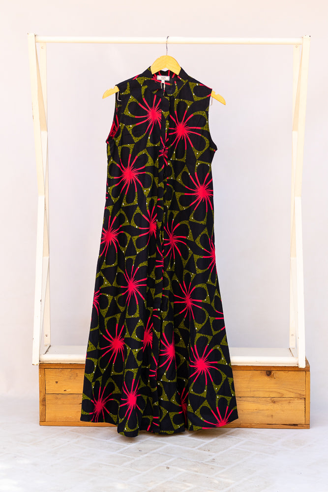 Display of navy and green dress with pink floral print.