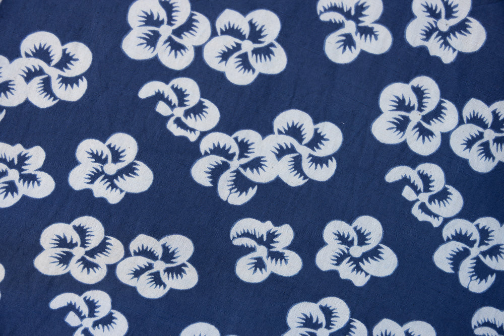Close up display of blue and white floral print dress, fabric.