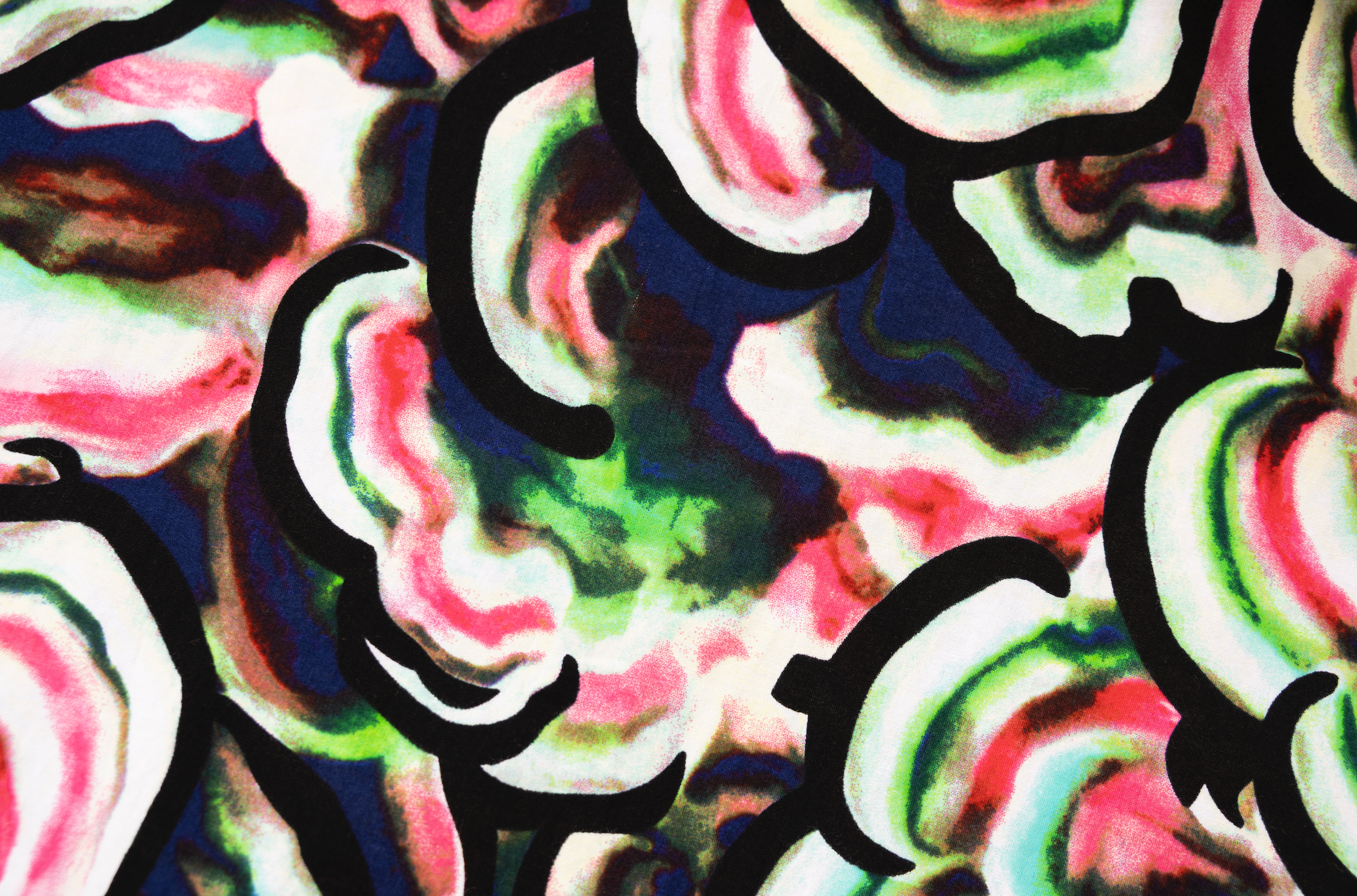 Close up display of colorful abstract print dress, fabric.