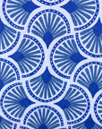 Close up display of blue and white mosaic print dress, fabric.