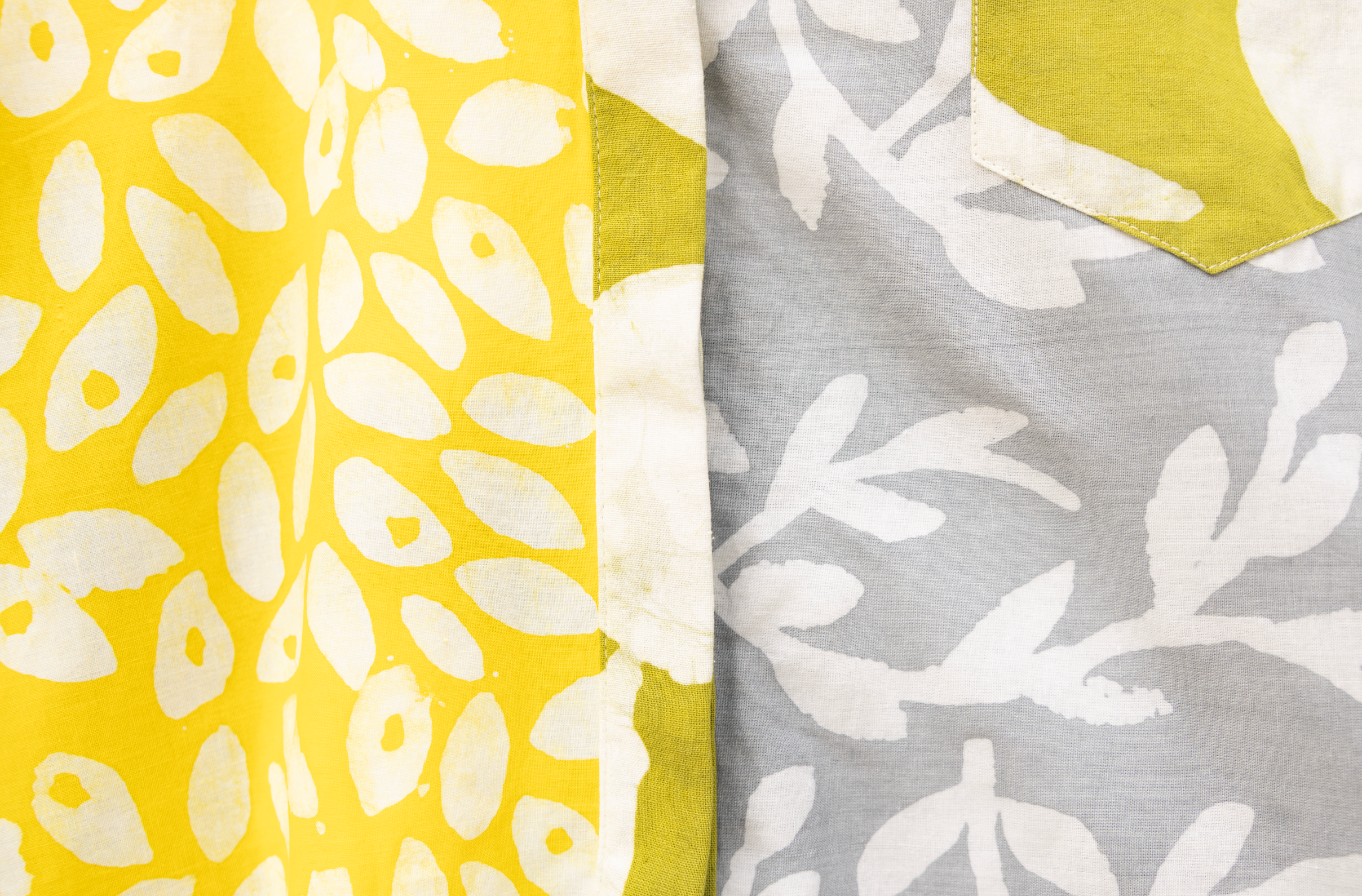 Close up display of  mutlicolored batik shortsleeved shirt, fabric.