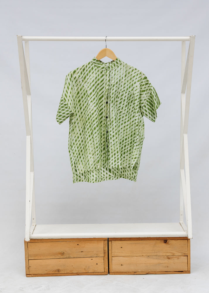 Display of green and white plaid shirt.