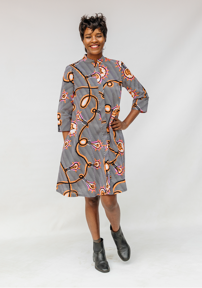 Model wearing black and white light bulb print dress.