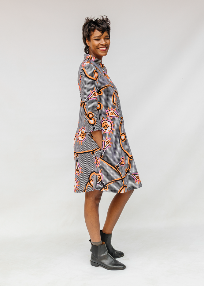 Model wearing black and white light bulb print dress.