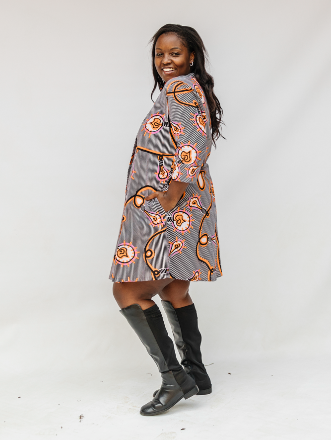 Model wearing black and white light bulb print dress.