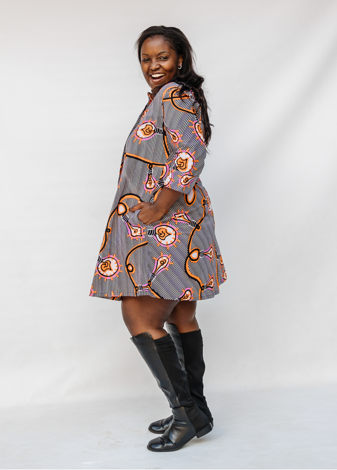 Model wearing black and white light bulb print dress.