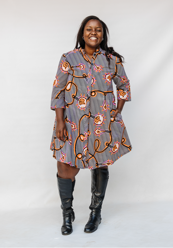 Model wearing black and white light bulb print dress.