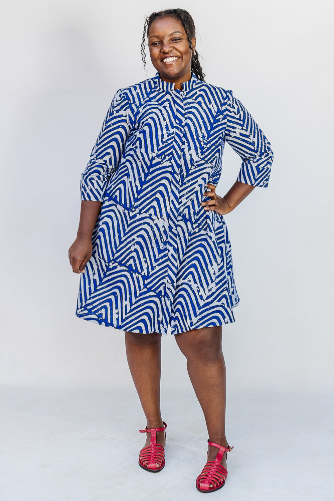 Model wearing blue and white zigzag print dress.