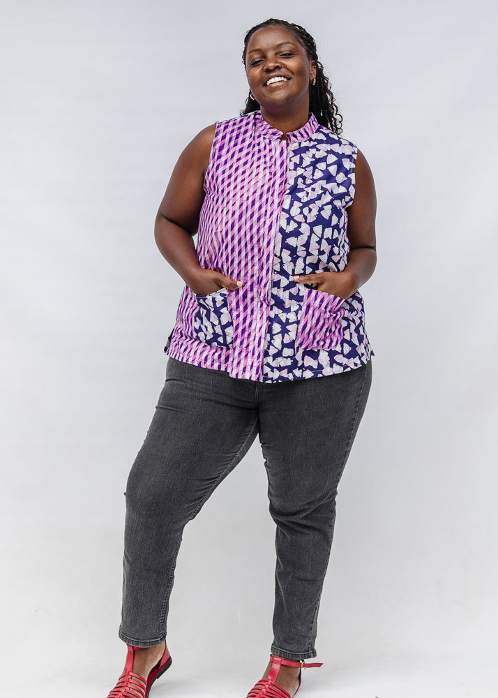 Model wearing purple, pink and white geometric print, patchwork sleeveless shirt.
