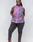 Model wearing purple, pink and white geometric print, patchwork sleeveless shirt.