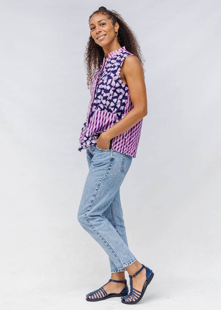 Model wearing purple, pink and white geometric print, patchwork sleeveless shirt.